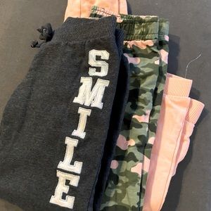 Three pairs of cute sweats.  Two pairs never worn. One worn twice.